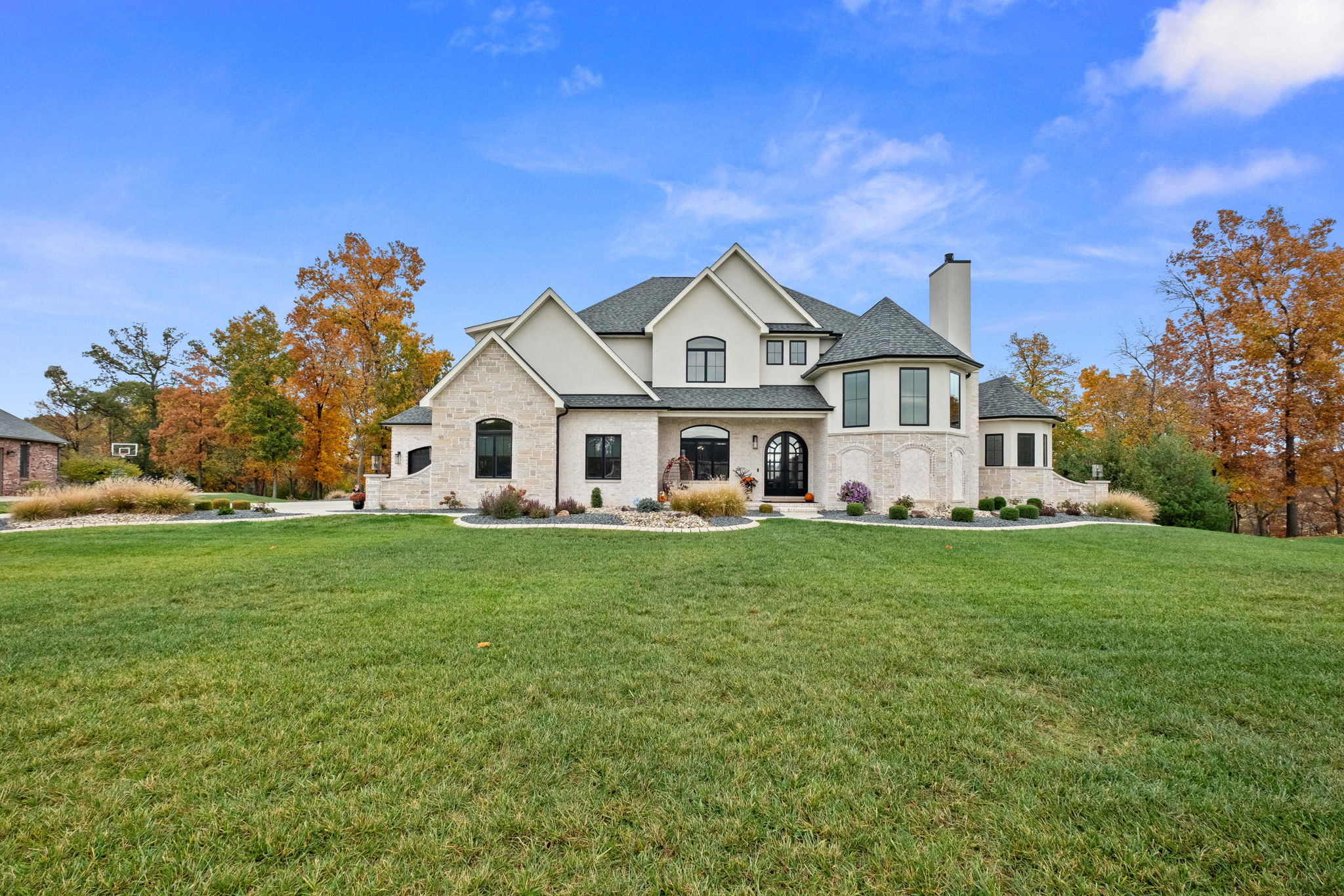 European-style home with stone front elevation and EIFS.