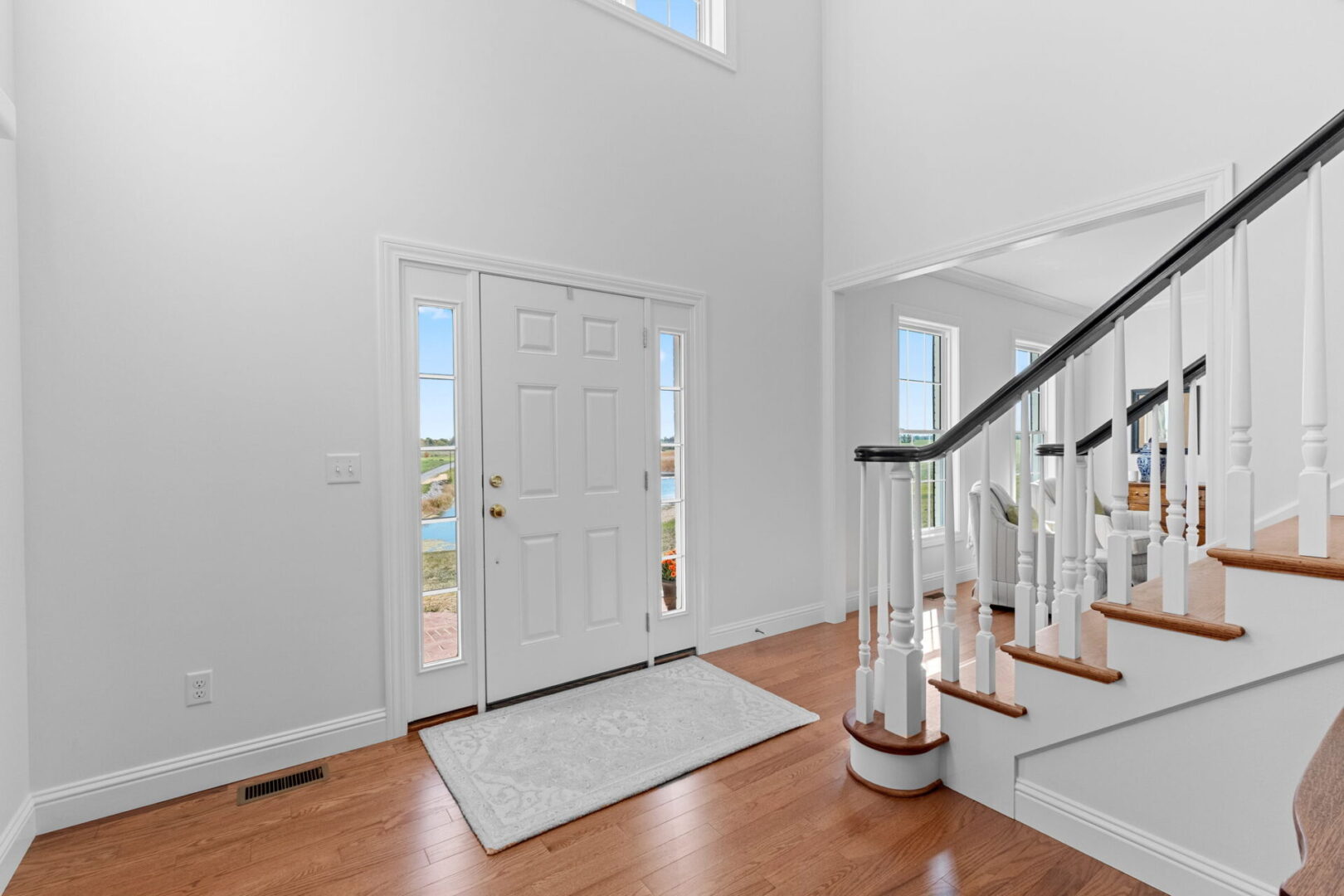 Entry way with custom wood staircase