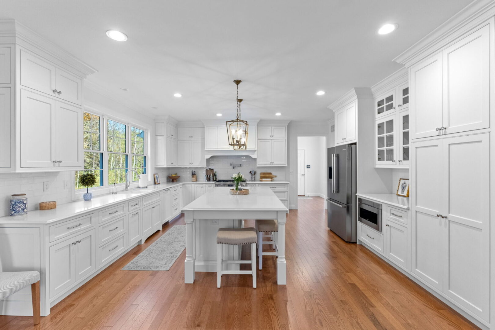 Exquisite kitchen with custom Shiloh cabinets paired with a spacious island and Cambria countertops.