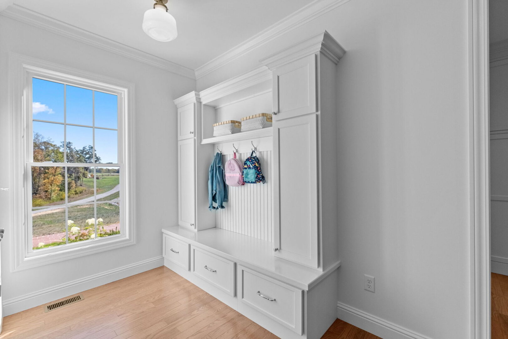 Garage and back door drop zone with custom built-in cubbies.