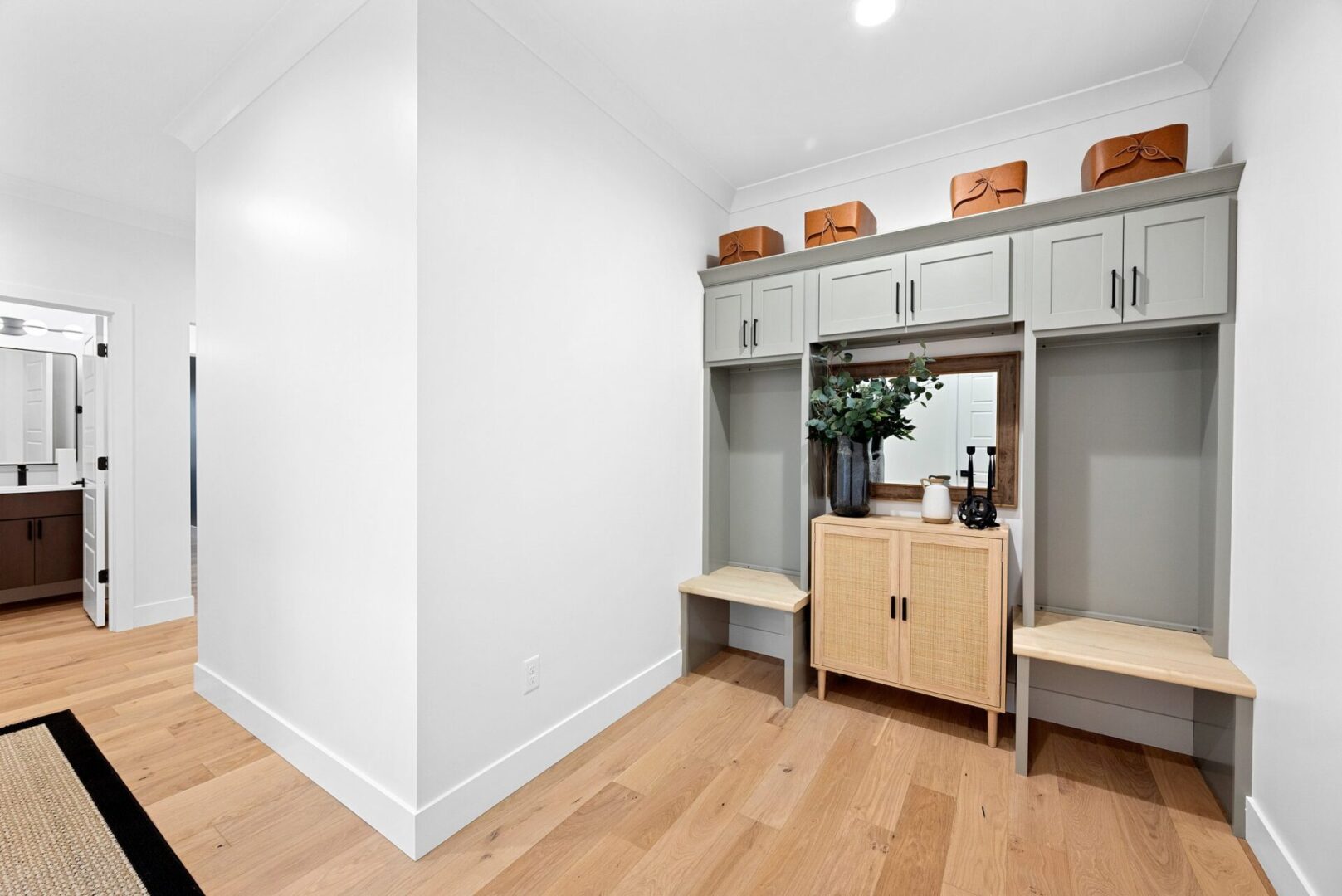 Garage entry drop zone and built in cabinets.
