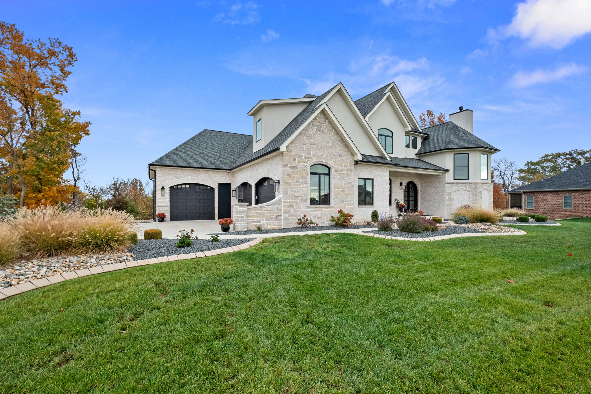 European-style home with stone front elevation and EIFS.