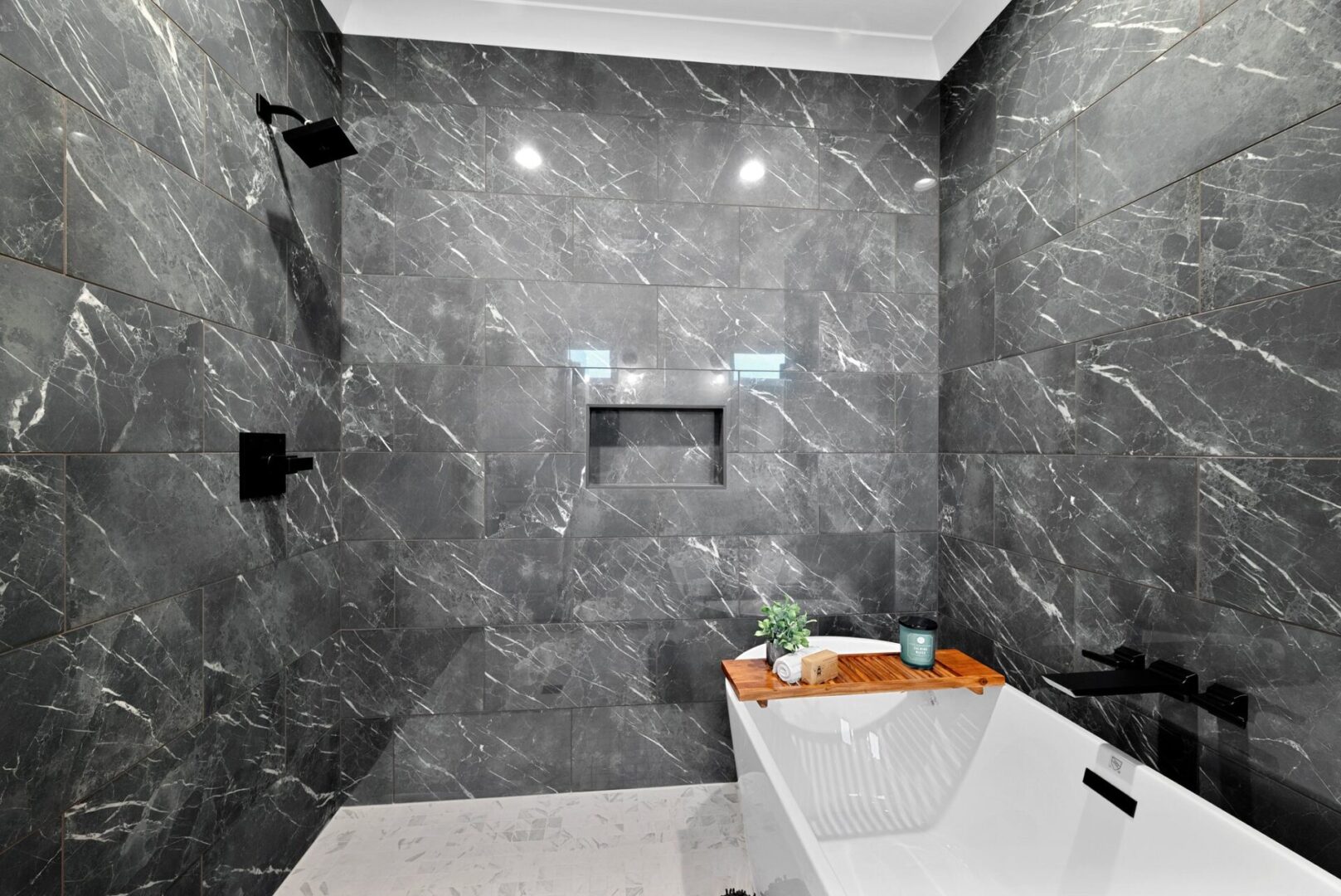 A primary bathroom designed as a wet room, featuring a shower and a freestanding tub, all enclosed by elegant glass.
