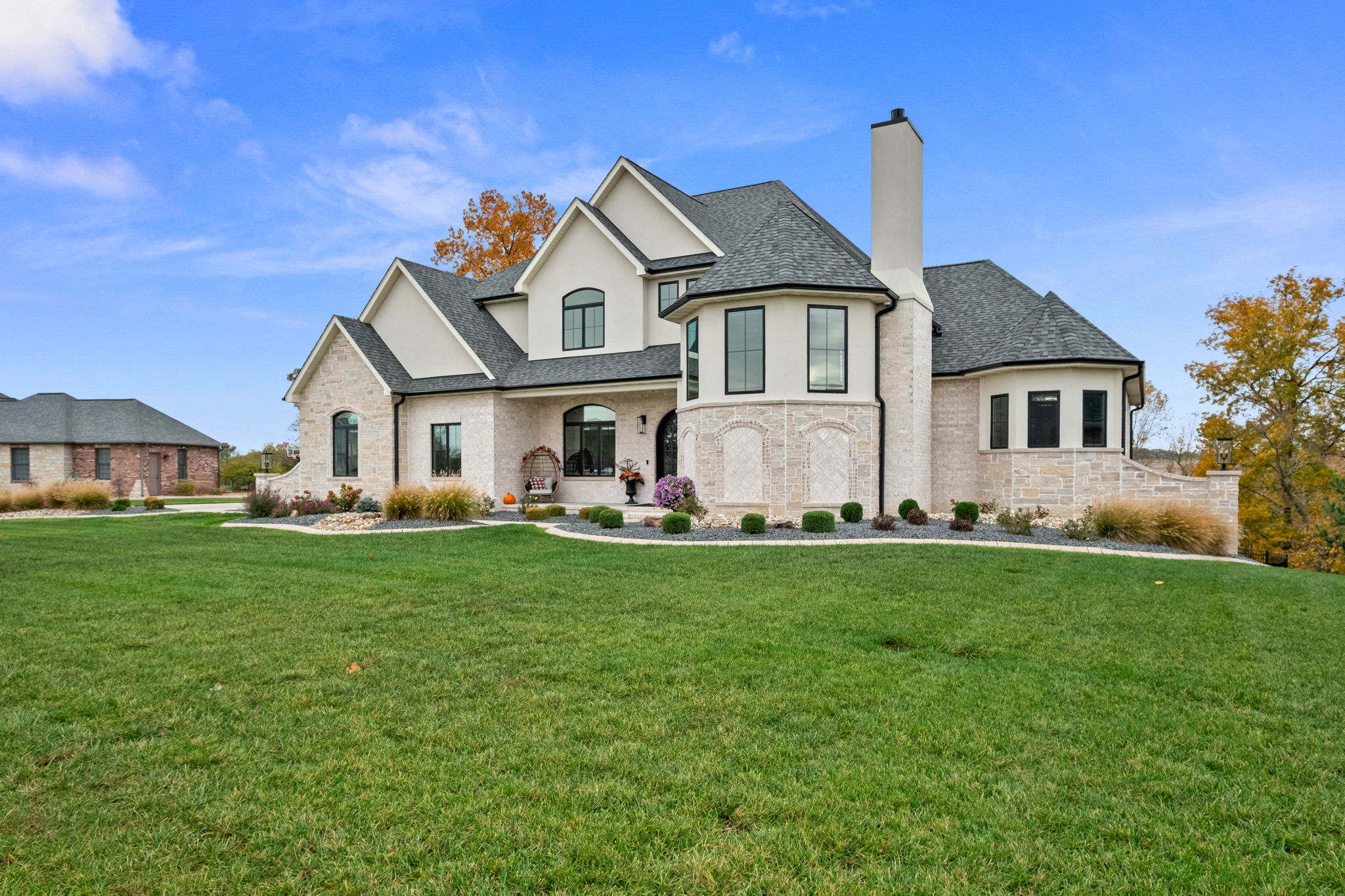 European-style home with stone front elevation and EIFS.