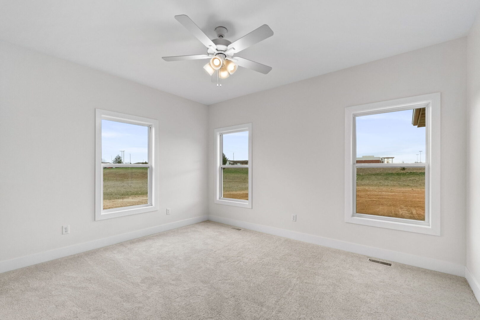 Bedroom number three features a softly-hued carpet and provides access to the Jack and Jill bathroom.