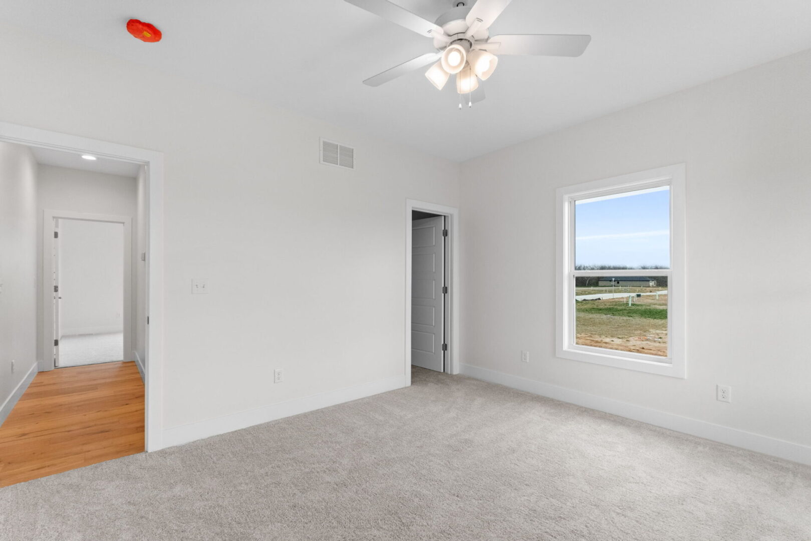 Bedroom number three features a softly-hued carpet and provides access to the Jack and Jill bathroom.