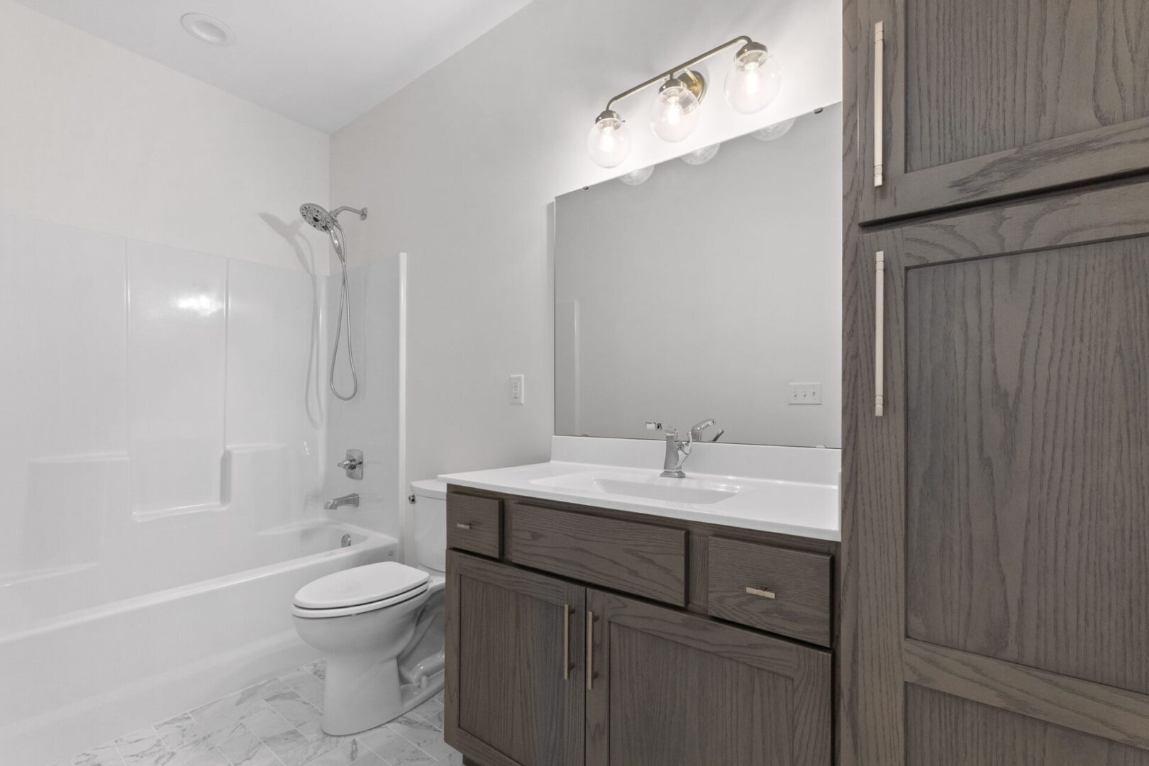 Jack and Jill bathrooms feature a combined tub and shower unit, along with a separate water closet, providing convenience and privacy.