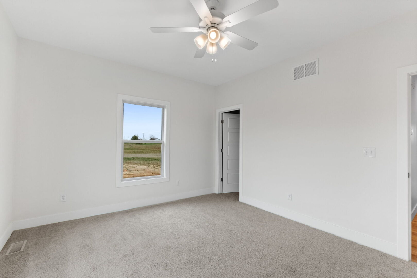 Bedroom number two features a softly-hued carpet and provides access to the Jack and Jill bathroom.