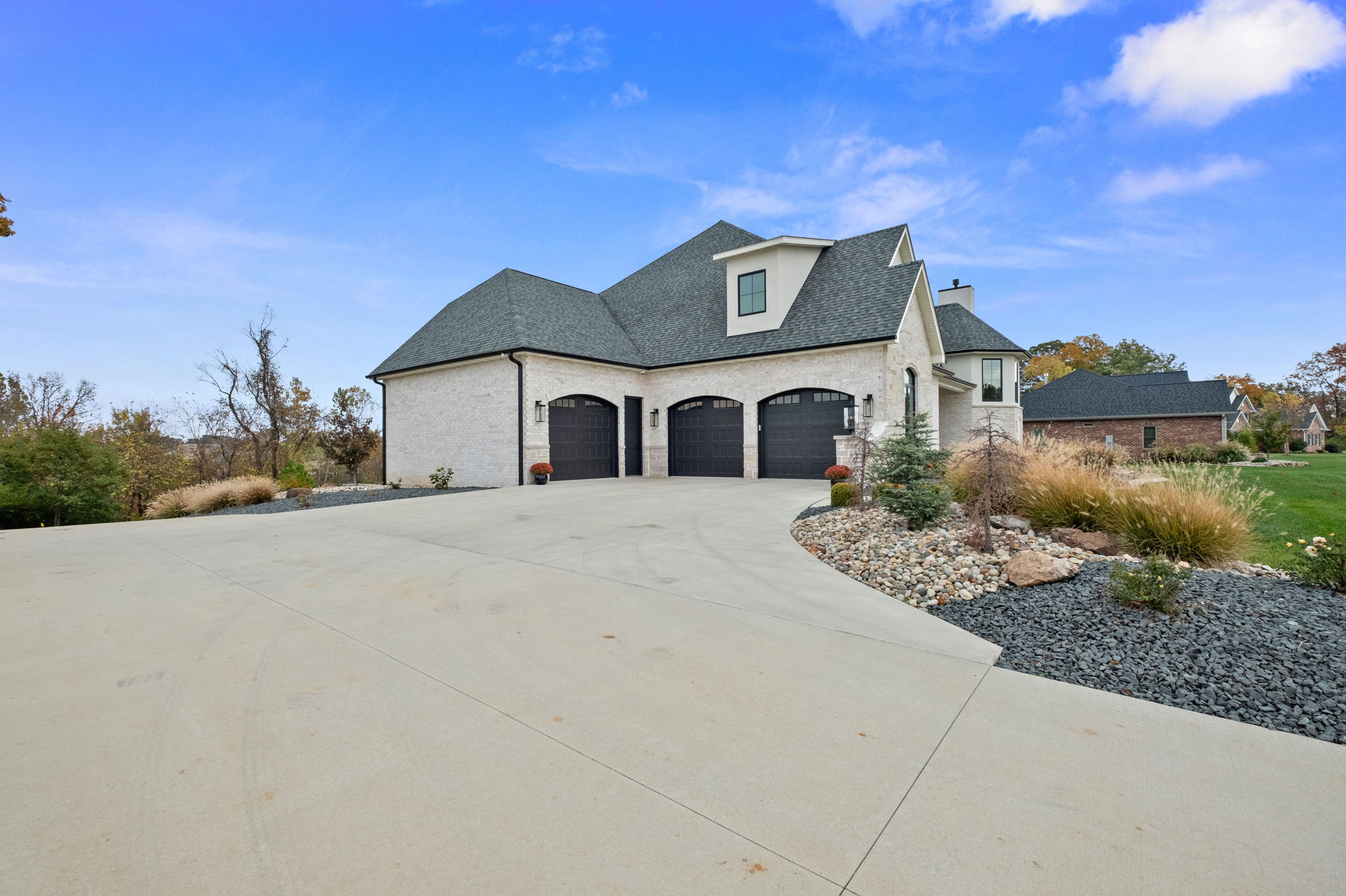 European-style home with stone front elevation and EIFS.