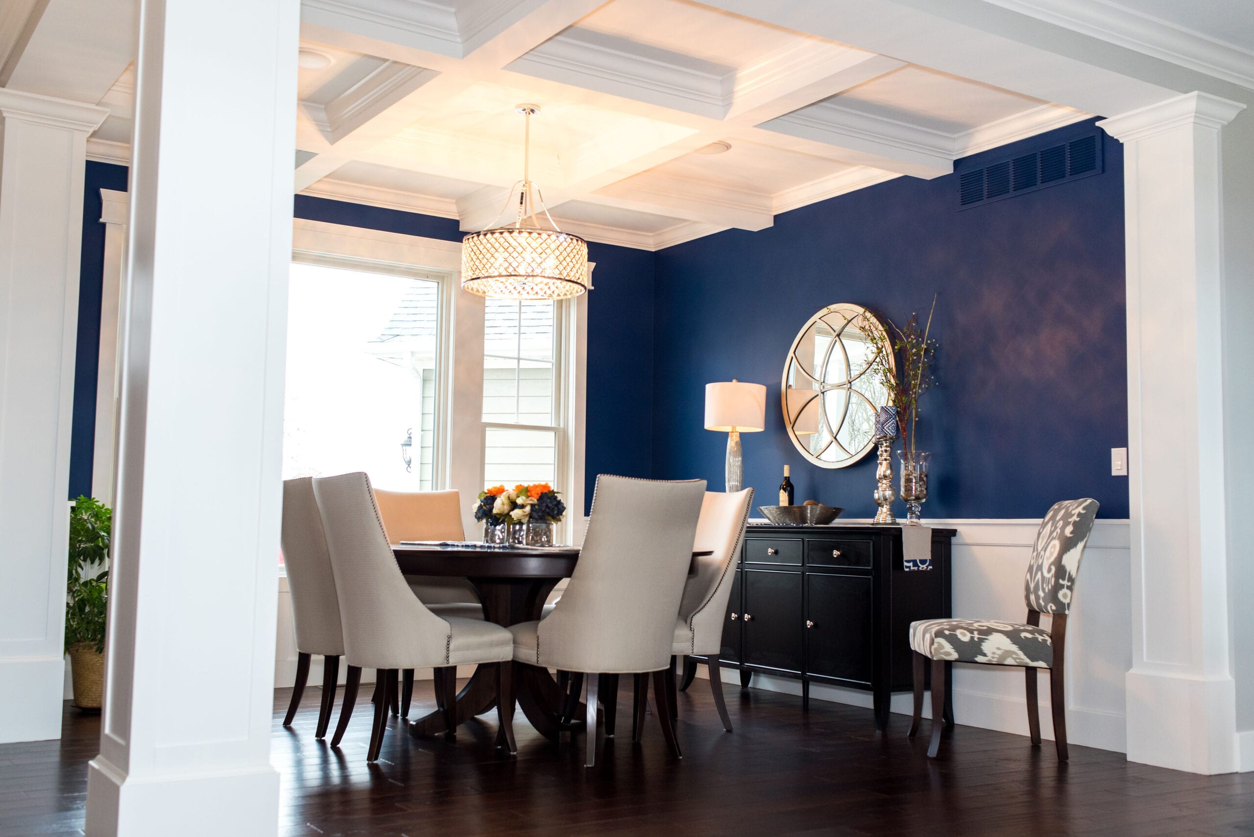 Formal dining room with coffered ceiling.