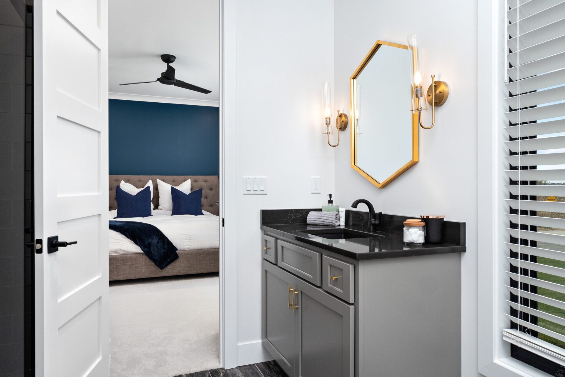 Bedroom two features an en-suite bathroom with a glass-tiled shower.