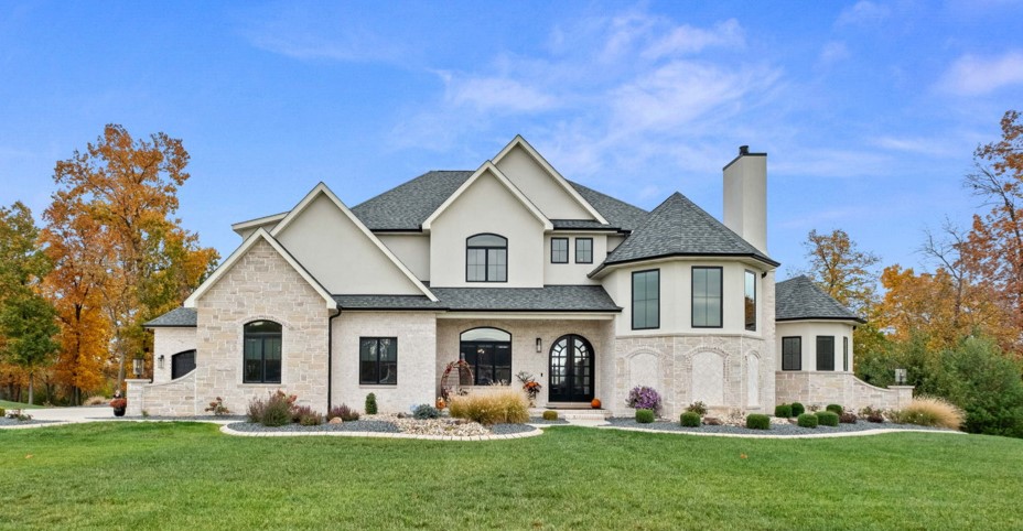 European-style home with stone front elevation and EIFS.